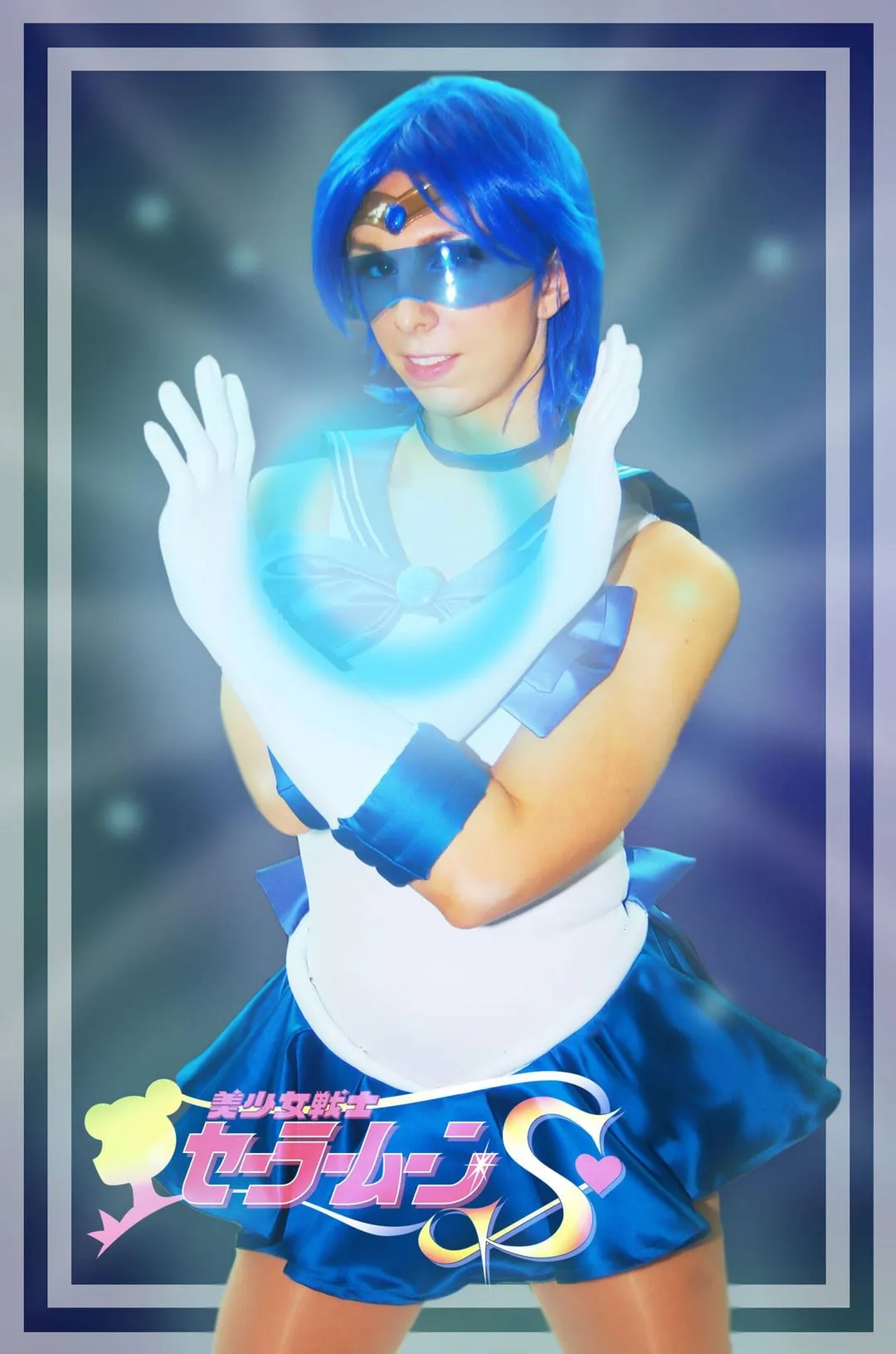 Jerikandra as Sailor Mercury from Sailor Moon with blue hair and visor, holding a glowing orb in a framed Sailor Moon S graphic.
